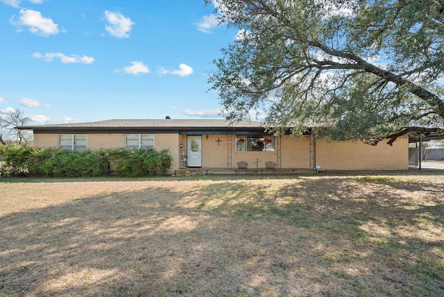 ranch-style house with a front lawn