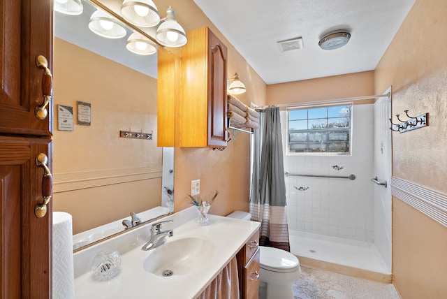 bathroom with vanity, toilet, and a shower with shower curtain