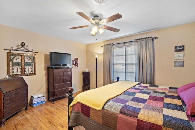 bedroom with ceiling fan and light hardwood / wood-style floors