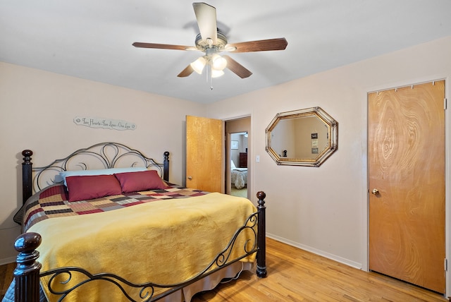 bedroom with light wood-type flooring and ceiling fan