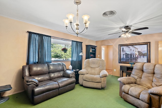 carpeted living room featuring ceiling fan with notable chandelier