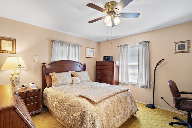 bedroom with light carpet and ceiling fan