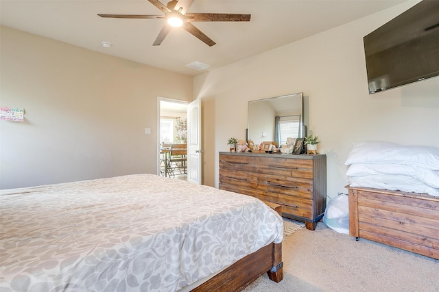 bedroom featuring ceiling fan and light carpet