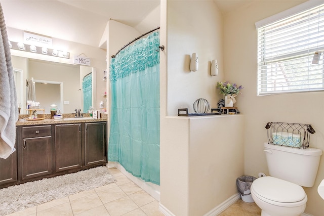 bathroom featuring vanity, tile patterned flooring, and toilet