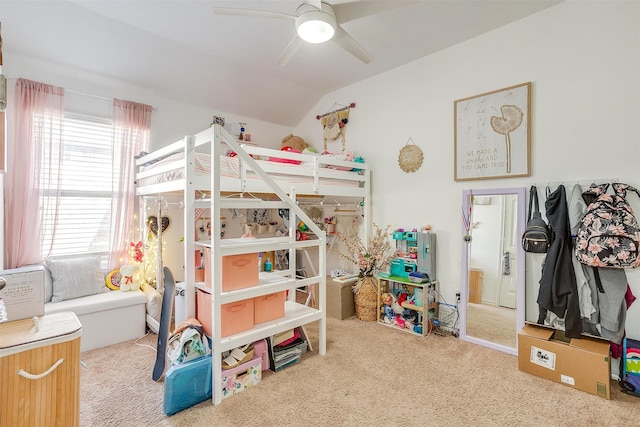 carpeted bedroom with vaulted ceiling and ceiling fan