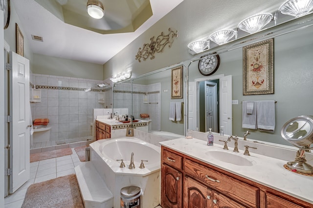 bathroom featuring tile patterned floors, independent shower and bath, and vanity