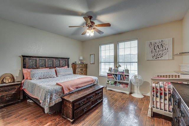 bedroom featuring dark wood-type flooring and ceiling fan