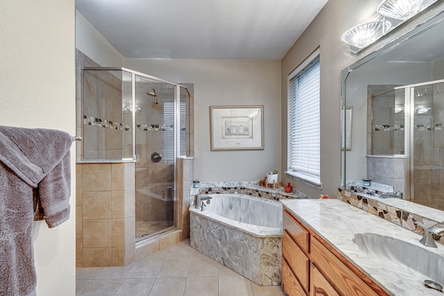 bathroom featuring independent shower and bath, vanity, tile patterned floors, and plenty of natural light