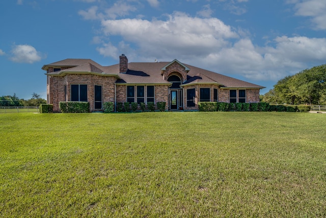 ranch-style house with a front yard