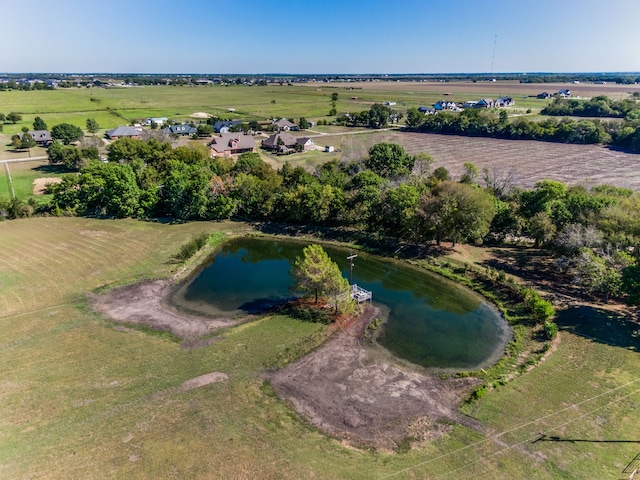 drone / aerial view with a rural view and a water view