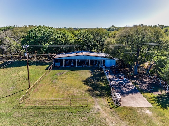 birds eye view of property with a rural view