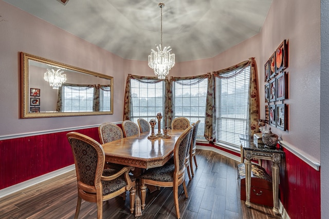 dining room with a chandelier and dark wood-type flooring