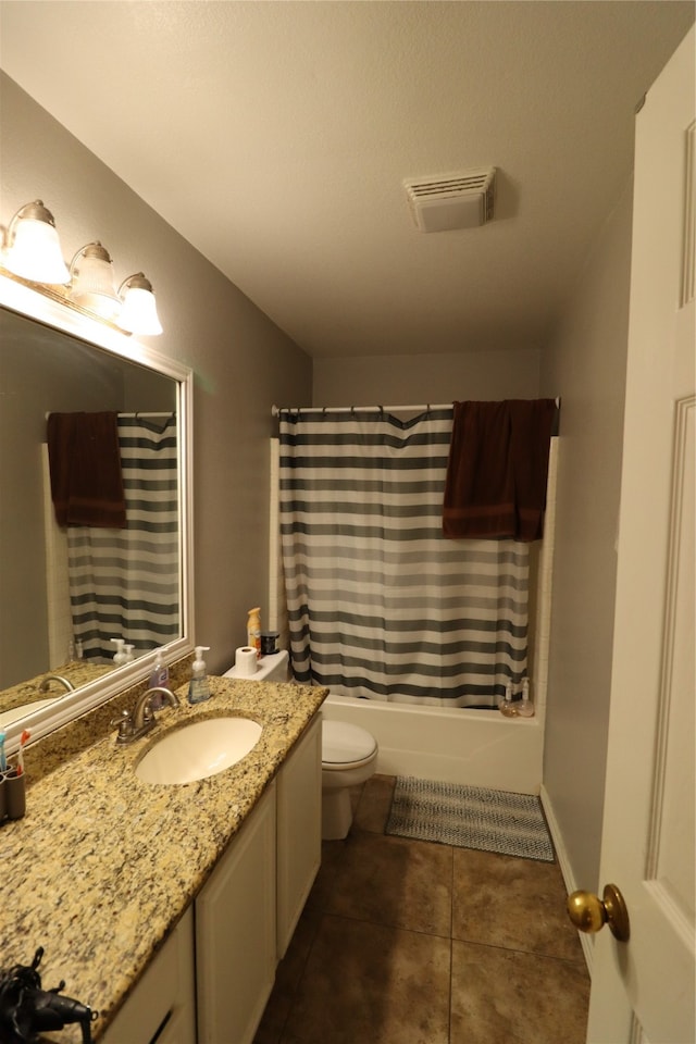 full bathroom featuring vanity, toilet, shower / bath combo with shower curtain, and tile patterned floors