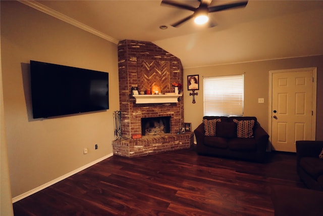 living room with ceiling fan, lofted ceiling, ornamental molding, a fireplace, and hardwood / wood-style floors