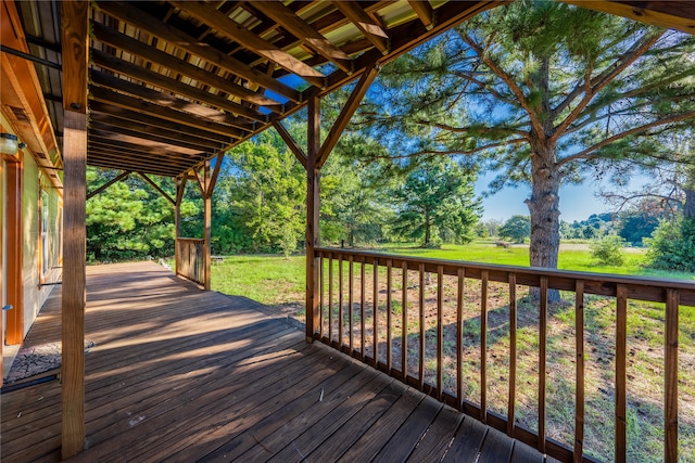 wooden terrace with a yard