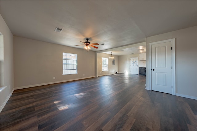 unfurnished living room with ceiling fan and dark wood-type flooring