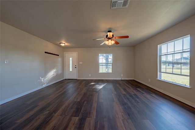 interior space with ceiling fan, dark hardwood / wood-style flooring, and a healthy amount of sunlight