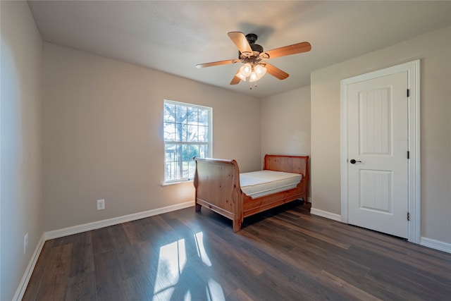 bedroom featuring ceiling fan and dark wood-type flooring