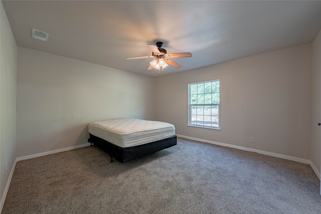 unfurnished bedroom with carpet and ceiling fan