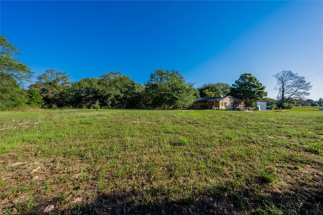 view of yard with a rural view