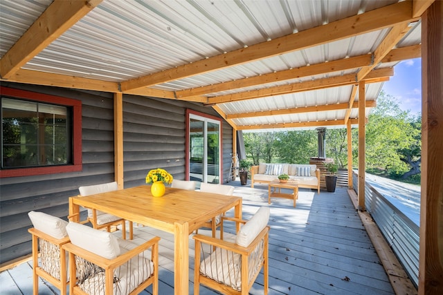 wooden terrace with an outdoor hangout area