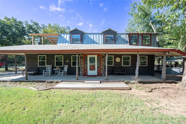 view of front of home with a wooden deck and a front yard