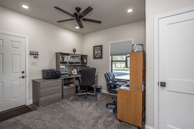 carpeted home office with ceiling fan