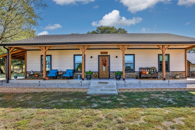 back of house featuring a yard and outdoor lounge area