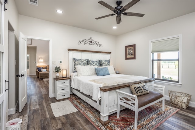 bedroom featuring ceiling fan and dark wood-type flooring