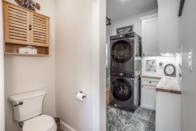 washroom with stacked washer / dryer