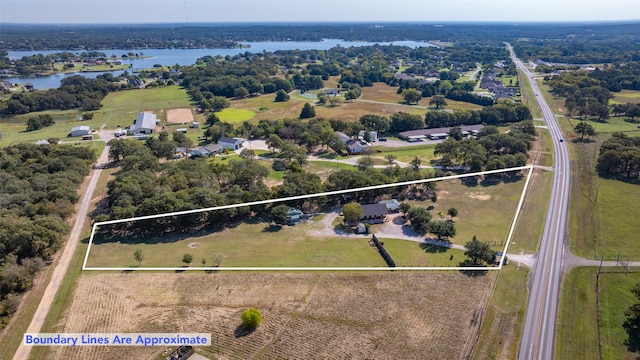 aerial view with a rural view and a water view