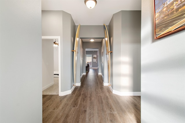 hallway featuring dark wood-type flooring