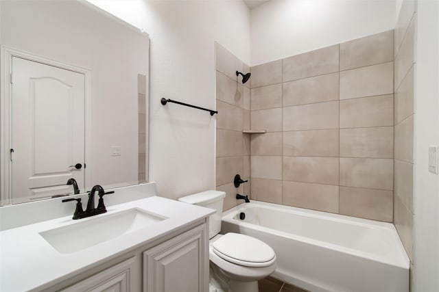 full bathroom with vanity, toilet, and tiled shower / bath