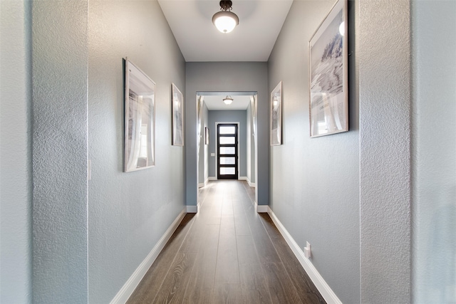 corridor featuring hardwood / wood-style floors