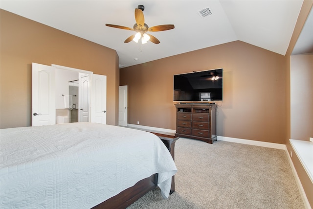 bedroom with ceiling fan, lofted ceiling, and light carpet