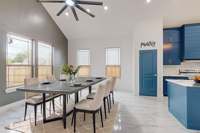 dining room with high vaulted ceiling and ceiling fan