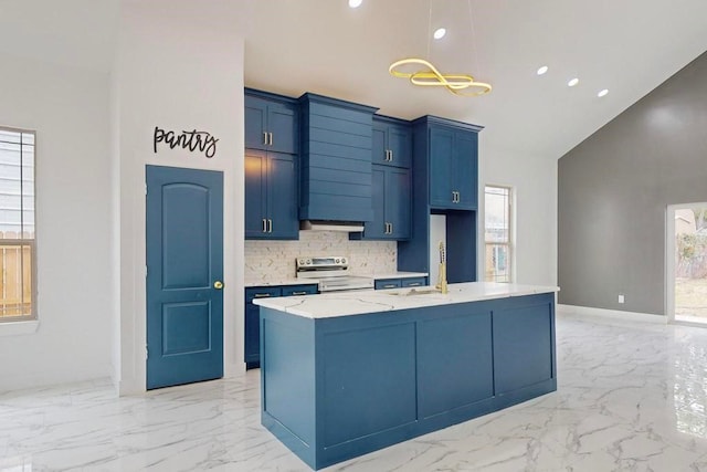 kitchen featuring light stone counters, a center island with sink, decorative light fixtures, stainless steel electric range oven, and decorative backsplash