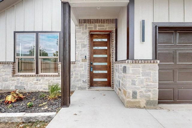 view of exterior entry with a garage