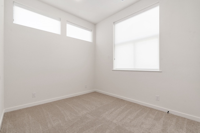 empty room featuring carpet flooring