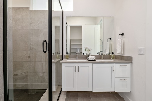 bathroom with vanity and an enclosed shower