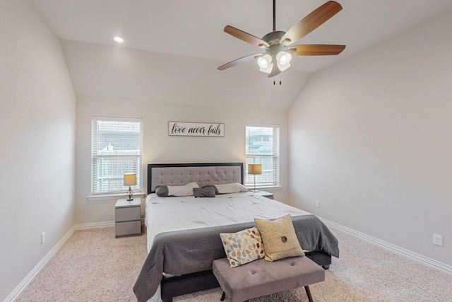 carpeted bedroom with lofted ceiling and ceiling fan