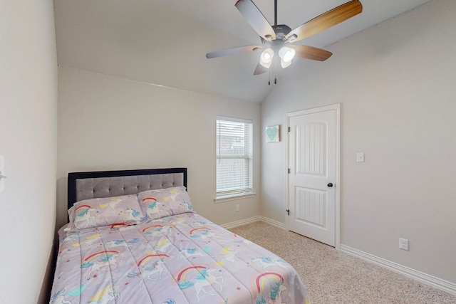 bedroom with vaulted ceiling, ceiling fan, and light colored carpet