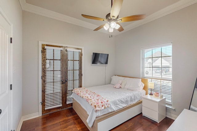 bedroom with ceiling fan, dark hardwood / wood-style floors, french doors, and crown molding