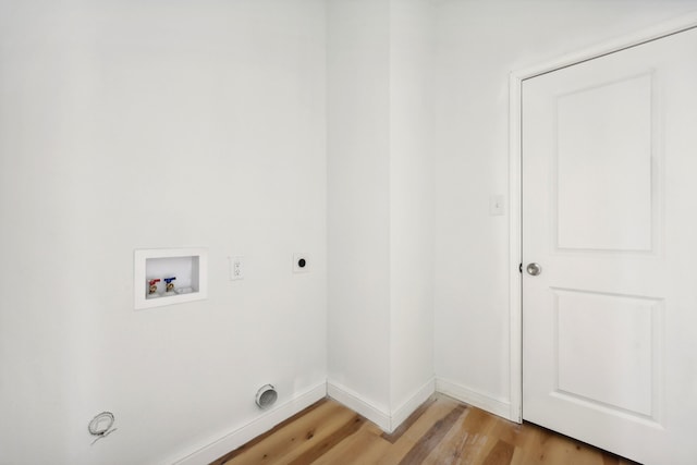 laundry area with hookup for a washing machine, light wood-style flooring, electric dryer hookup, laundry area, and baseboards