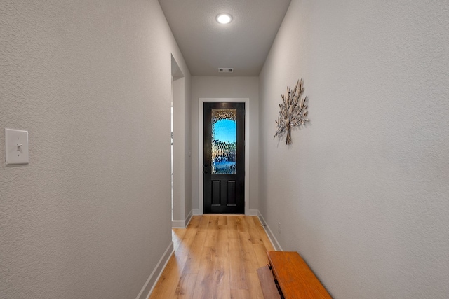 doorway to outside with light hardwood / wood-style flooring