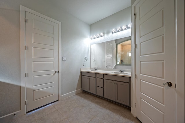 bathroom featuring tile patterned flooring and vanity