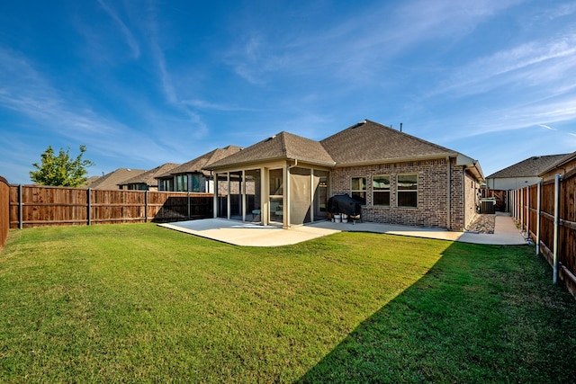 back of house featuring a patio, cooling unit, and a lawn