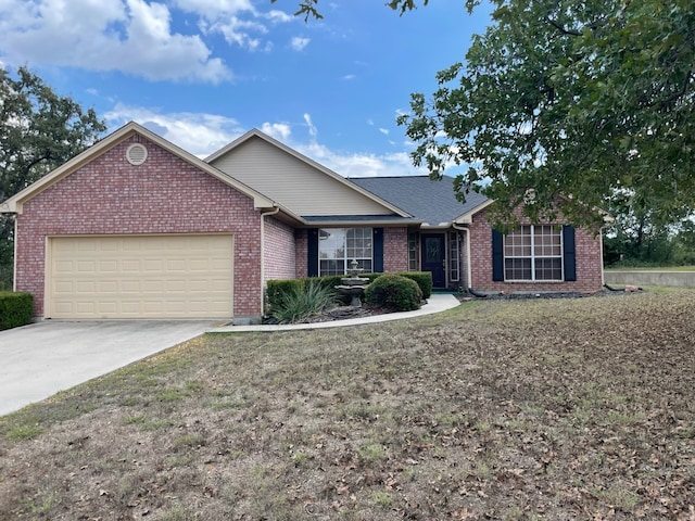 view of front of property with a front lawn and a garage