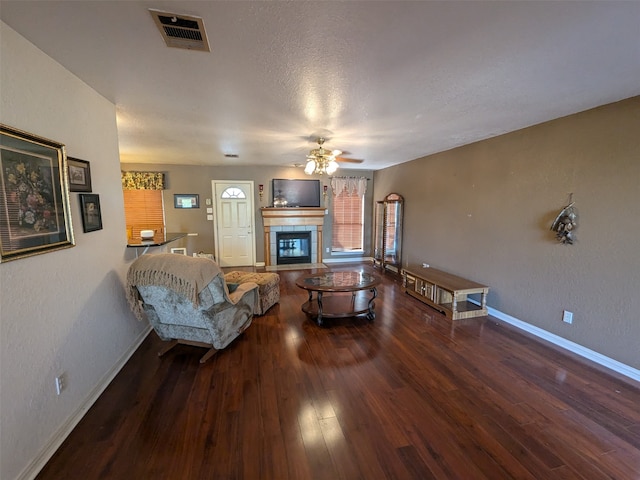 living room featuring ceiling fan and hardwood / wood-style floors