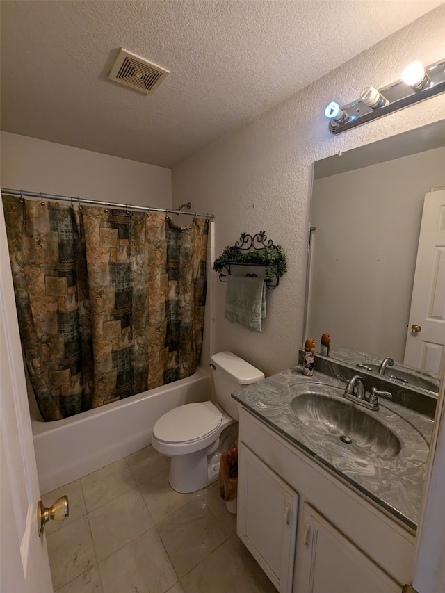 full bathroom featuring a textured ceiling, toilet, vanity, shower / tub combo with curtain, and tile patterned flooring